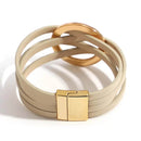Pulseira Solarie | Couro Envoltório & Elo Dourado